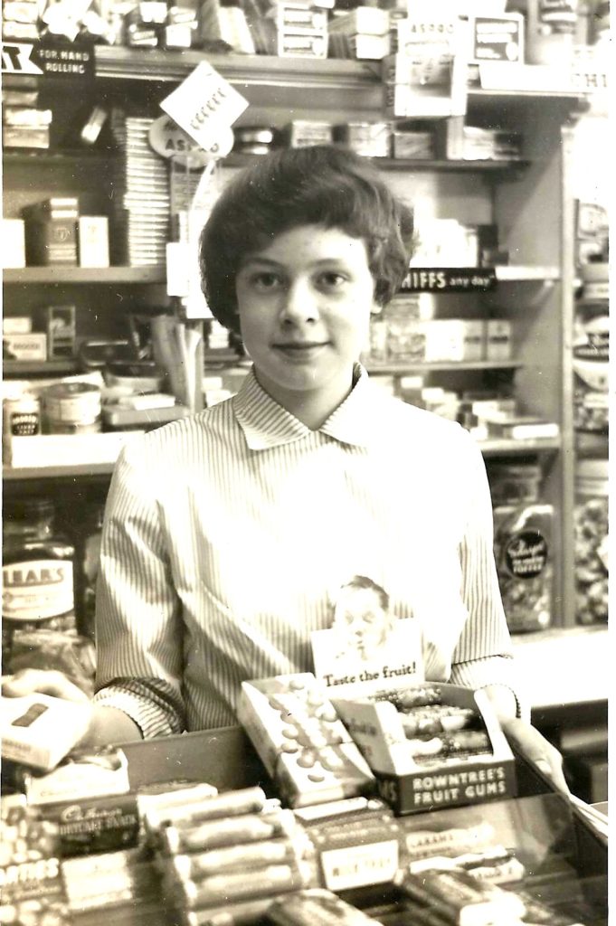 Margaret Sidlow serving in the shop.